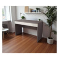 Dark grey writing desk beside a window