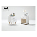White bedside tables with tapered legs and wood-look drawers