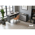 Grey L-shaped desk with storage unit in a home office