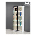 Black-framed glass display cabinet with illuminated shelves