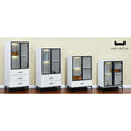 Black-framed glass display cabinets in four heights