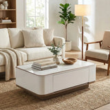 White Elora coffee table with rounded corners beside a cream sofa