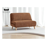 Brown armless fabric sofa bed beside a window