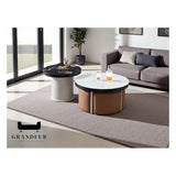 Round white-top coffee table with stools and black-top side table