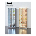 Glass display cabinets with dark and gold-coloured frames