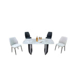 White stone-patterned dining table with black and beige chairs, angled view