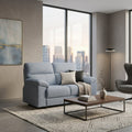 Blue Vista sofa beside a window and coffee table