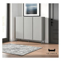 Grey shoe cabinet with three doors in an entryway