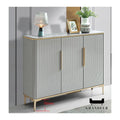 Wide grey shoe cabinet with patterned doors and gold-coloured handles