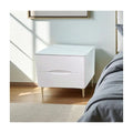 White bedside table with pale stone-patterned top and gold-coloured legs