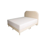 Cream Sorella upholstered bed with rounded headboard and tapered legs