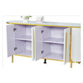 White fluted side cabinet with doors open, showing lilac interior shelves