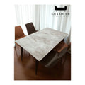 Pale stone-patterned dining tabletop, angled overhead view