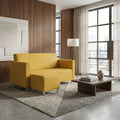 Yellow Lina sofa and ottoman beside a window