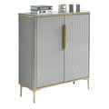 Narrow grey shoe cabinet with patterned doors and gold-coloured frame