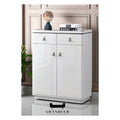 Narrow glossy white shoe cabinet in a hallway