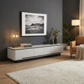 Grey Vallin TV console beneath framed artwork in a dark room