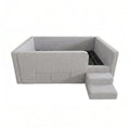 Grey enclosed daybed frame with access steps, overhead view