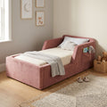 Pink Elyssia bed with bedding in a bright bedroom