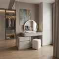 Grey Mila dressing table beside an open wardrobe