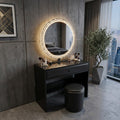 Black Vivienne vanity desk with illuminated mirror against a dark wall