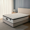Snoova Prestige mattress on a pale bed frame beside a window