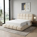 Cream Cadenza bed with white bedding beside a large window
