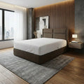 Brown Avalise bed beside a large window