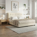 Cream Valenx tufted bed beside a window