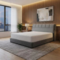 Grey Olera bed in a bedroom at dusk
