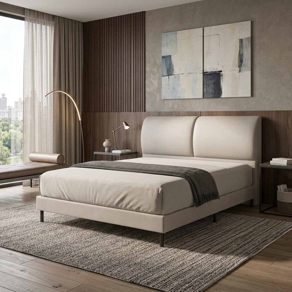 Beige upholstered bed beside a window, angled view