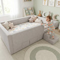 Child beside grey Caelia daybed with upholstered steps