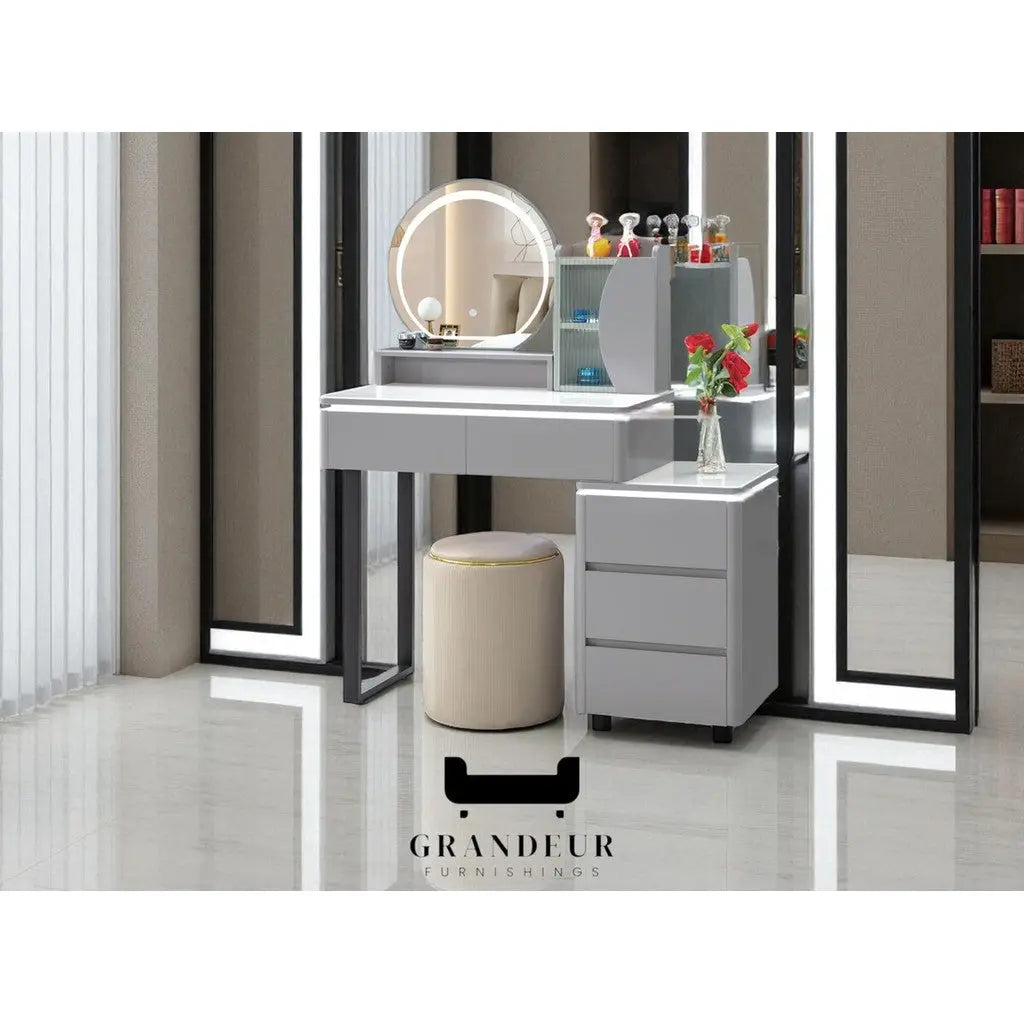 Grey dressing table with illuminated round mirror and cylindrical stool